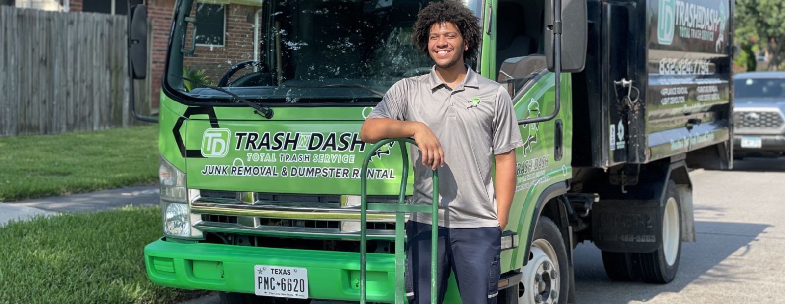 trash n dash employee ready to remove construction debris