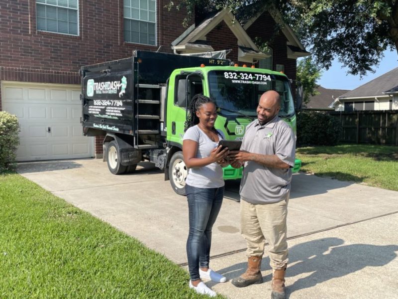trash n dash junk removal pro talking to customer about a quote
